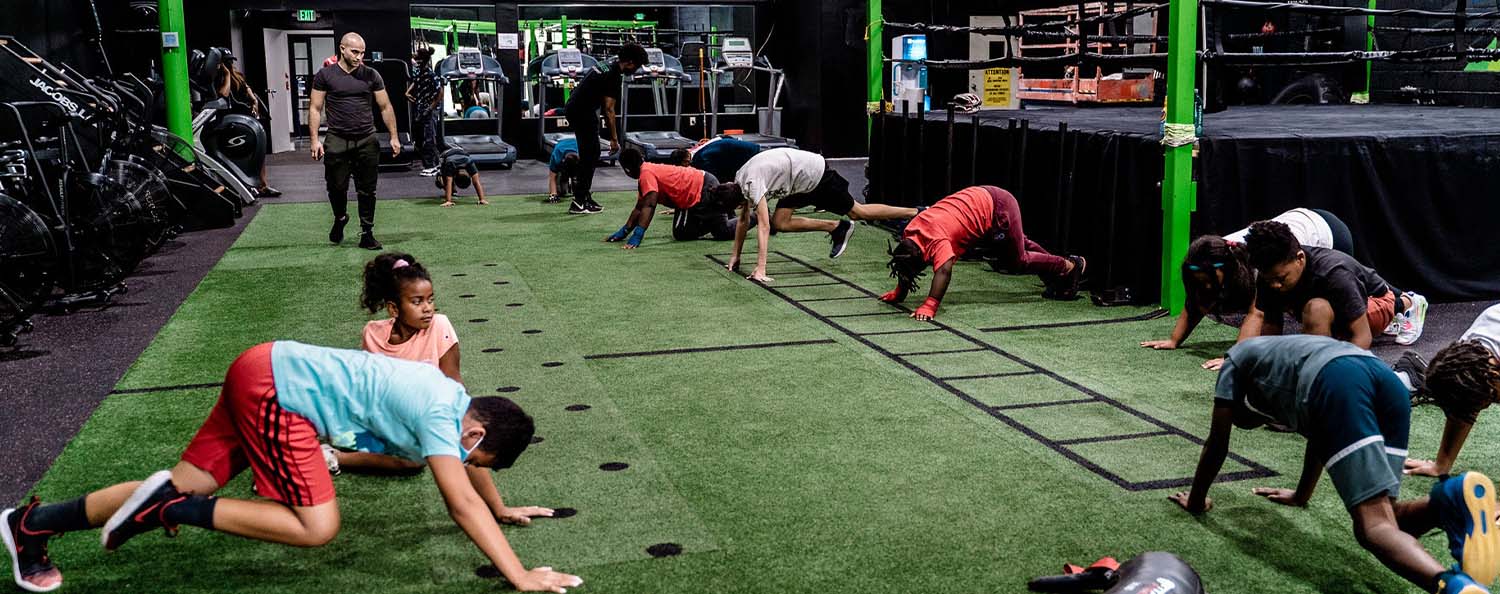 Kids are taught boxing at Elite Fitness Classes in Columbia, Ellicott City, Baltimore Maryland